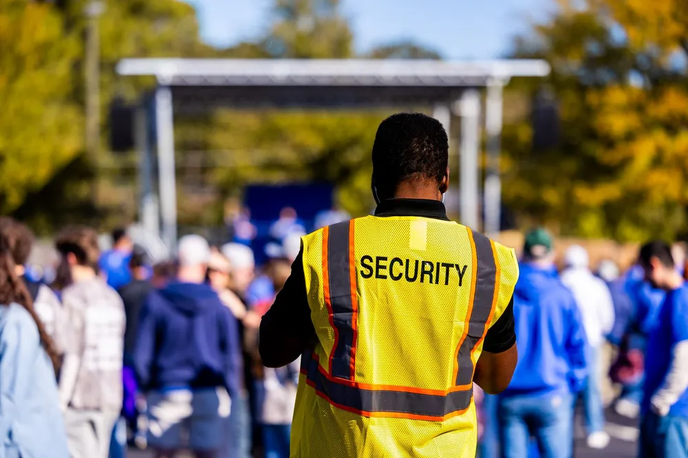 Part-time event crew in vests ready to be hired for a job in Malaysia