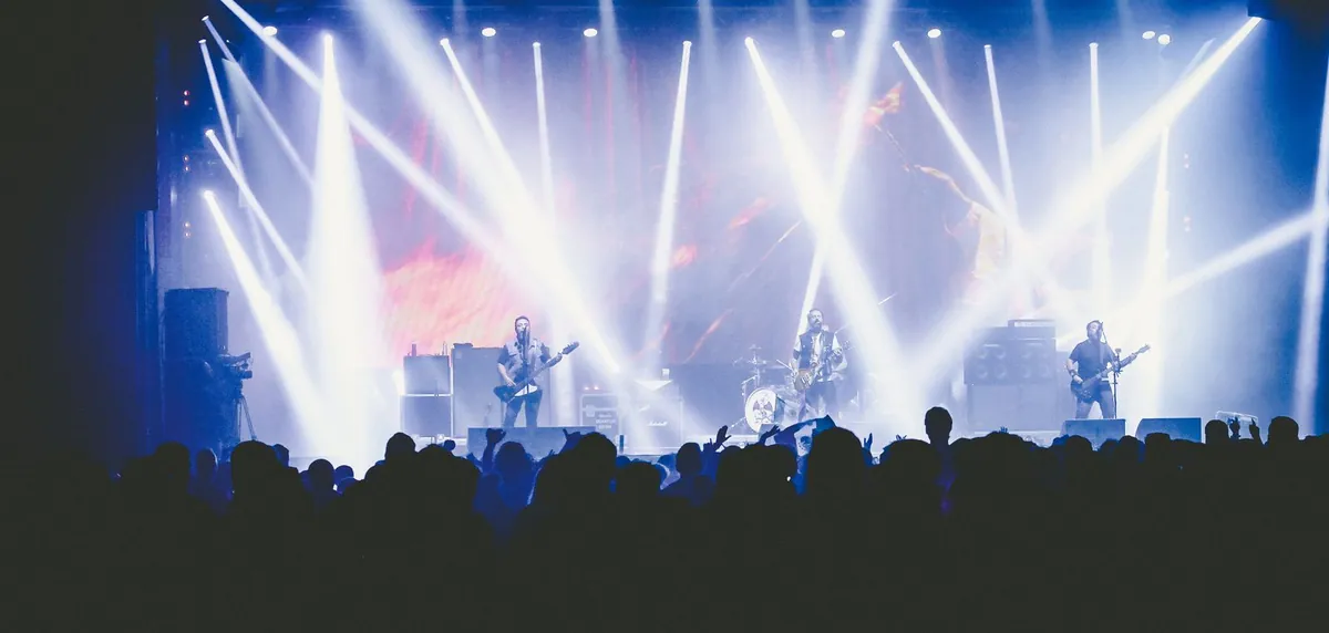 Stage lights over a live concert crowd at an event crewed in Malaysia